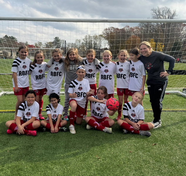 Real Boston FC players and coach together