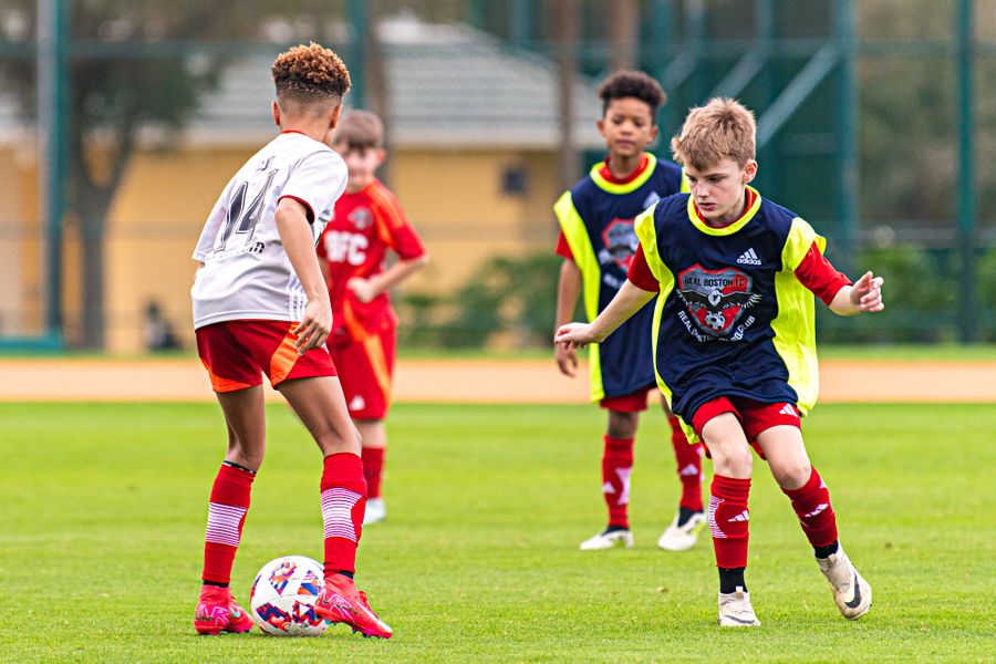 Real Boston FC players competing during an outdoor session