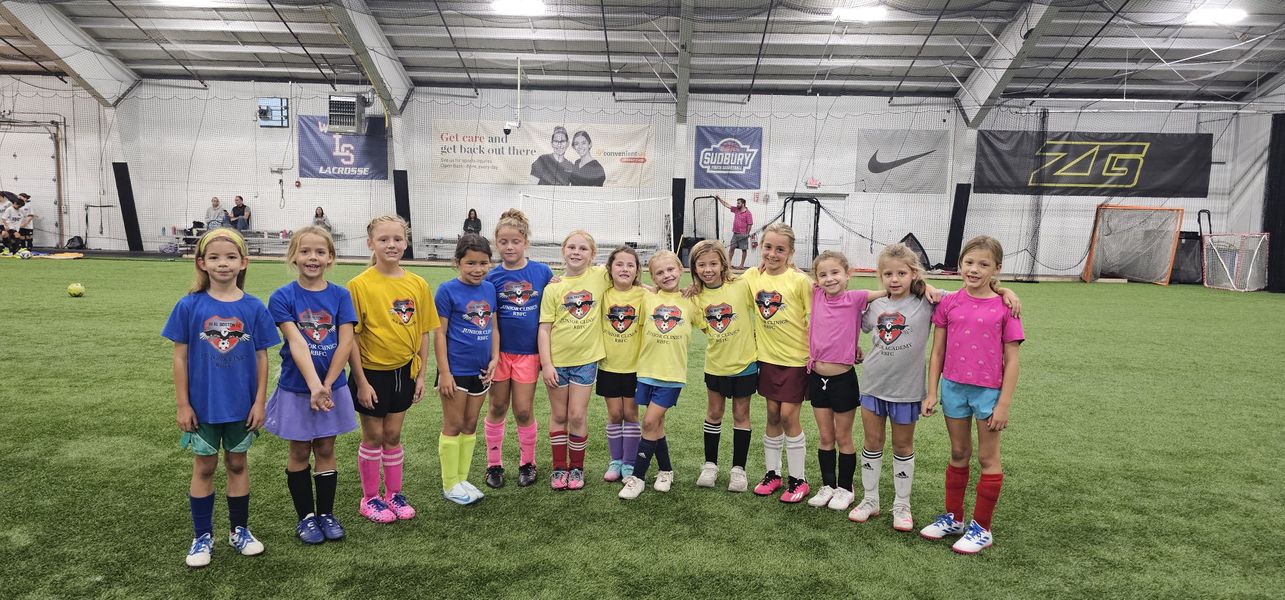 Young Real Boston FC clinic players smiling together